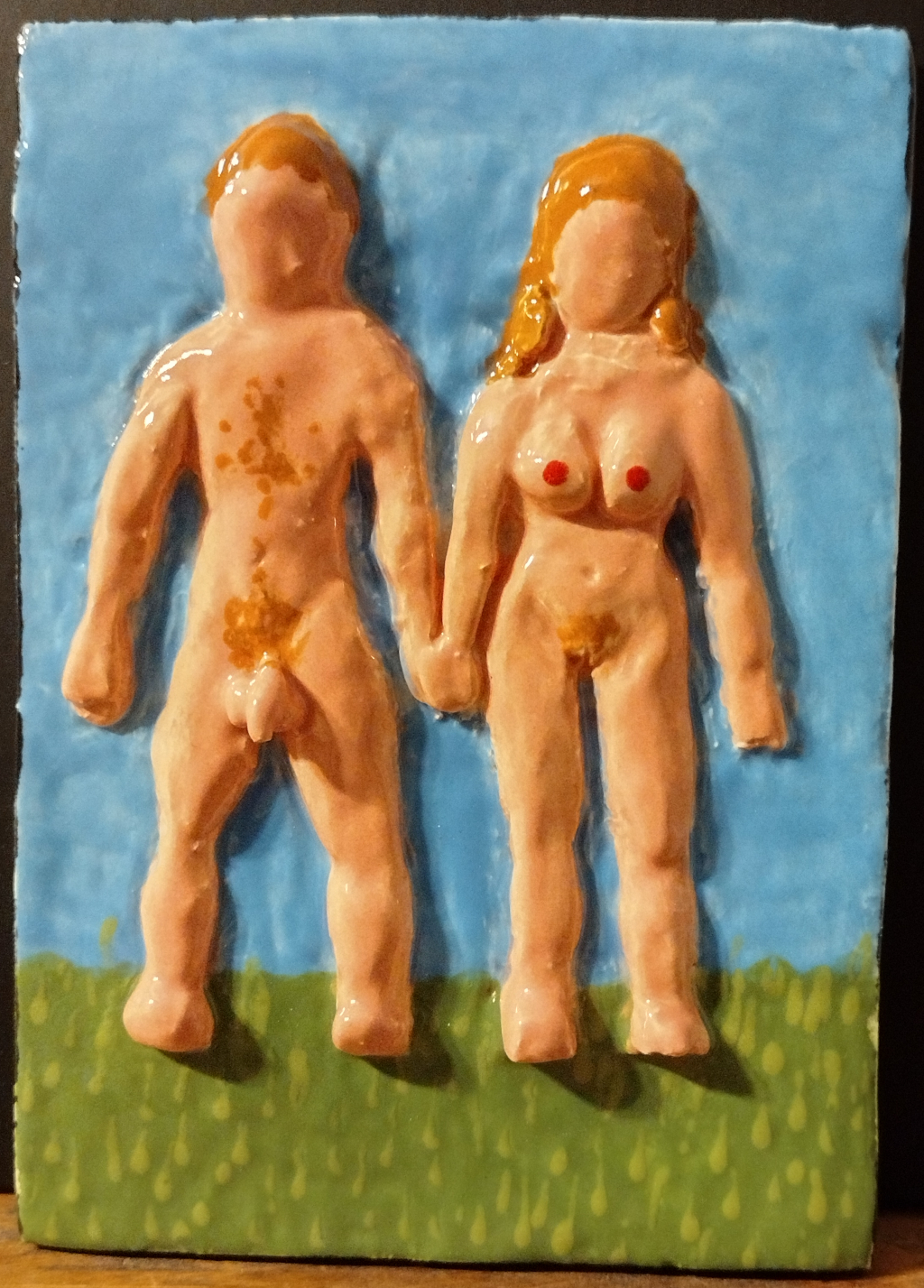 Adam and Eve ceramic: a plaque with a male and female nude